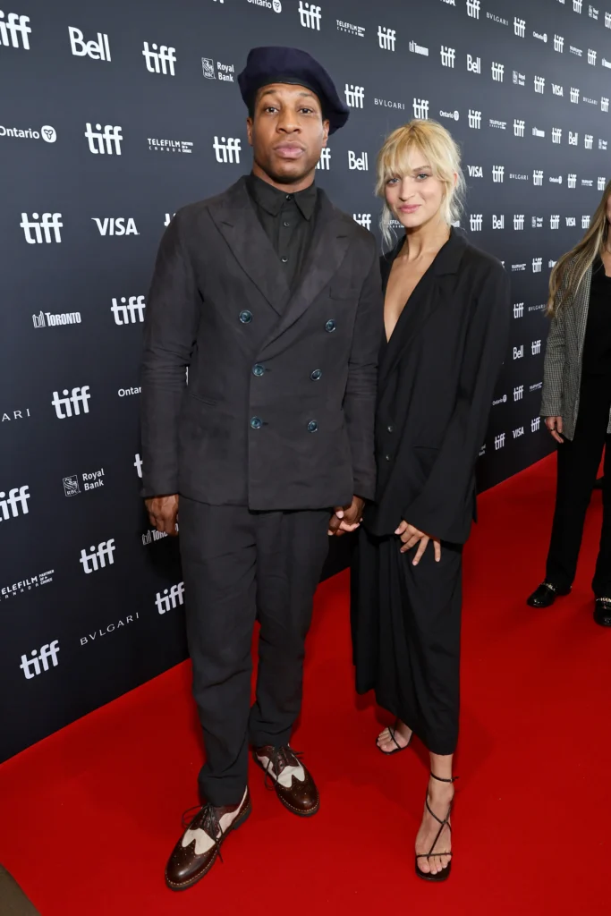 Jonathan Majors and Grace Jabbari at an event