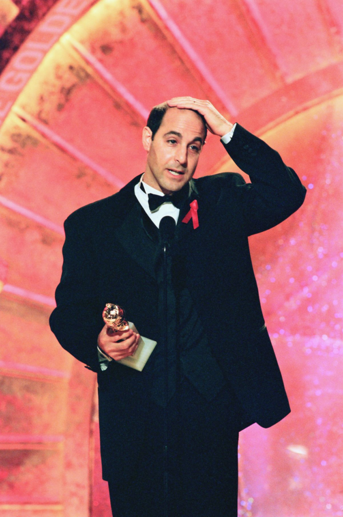 Stanley Tucci accepting an award at the 56th Annual Golden Globe Awards