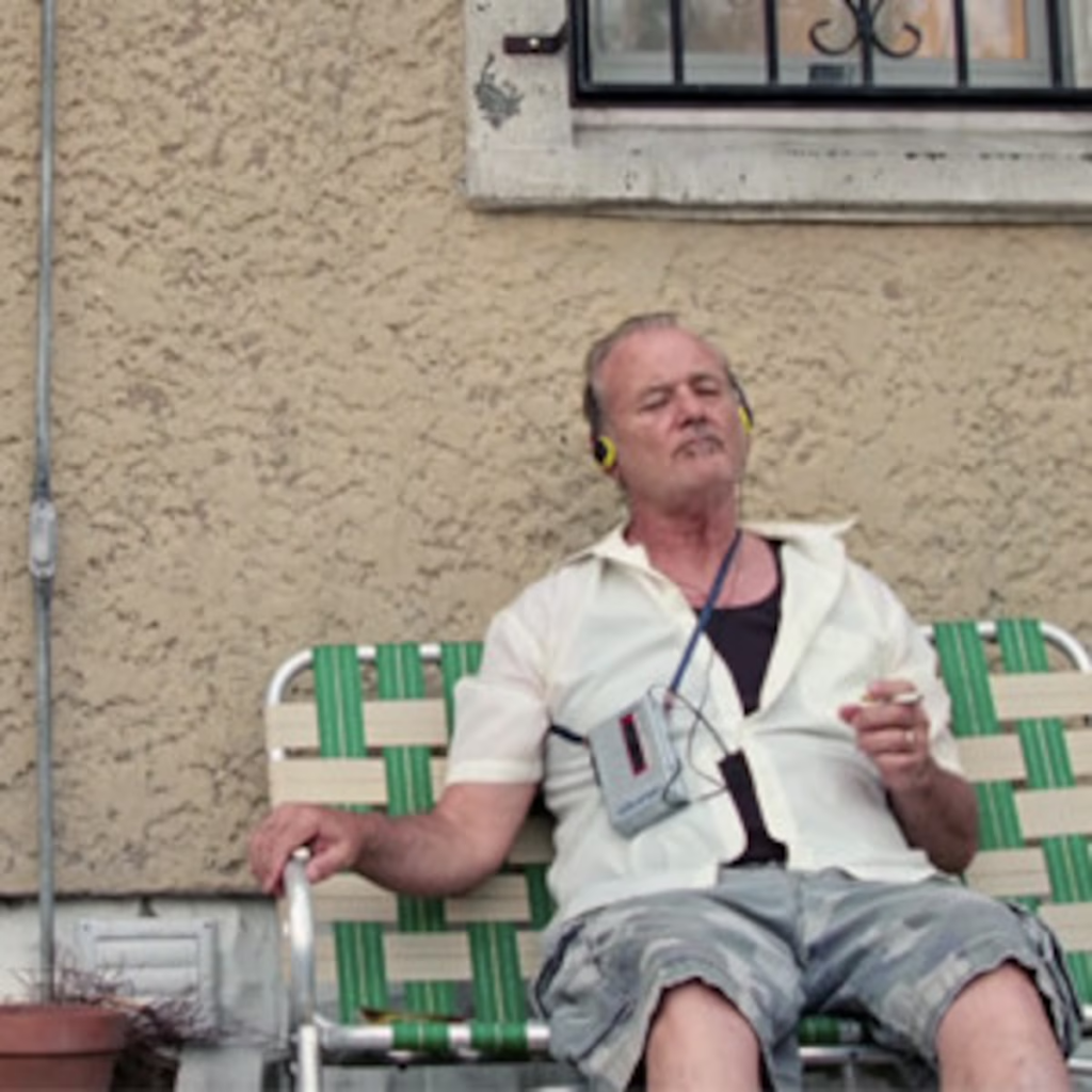 Bill Murray in a scene from the 2014 film St. Vincent. In the scene, his character, Vincent MacKenna, is singing along to Bob Dylan's song "Shelter from the Storm"