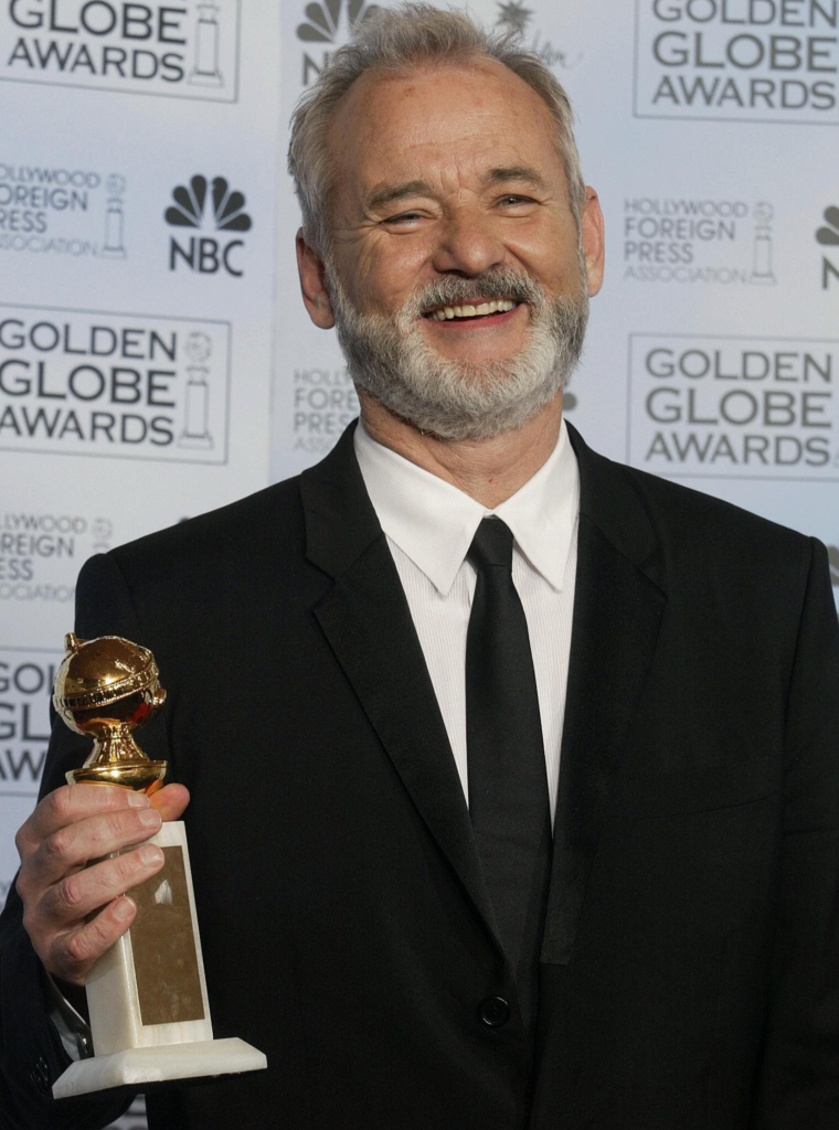 Bill Murray happily holding his Golden Globe award