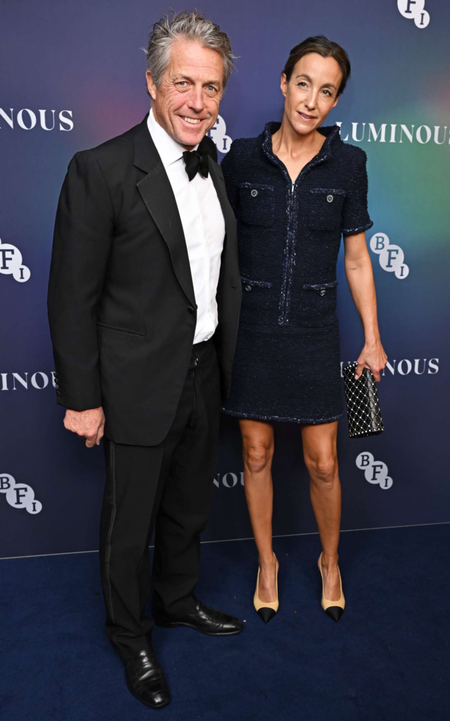 Hugh Grant and Anna Eberstein at an event