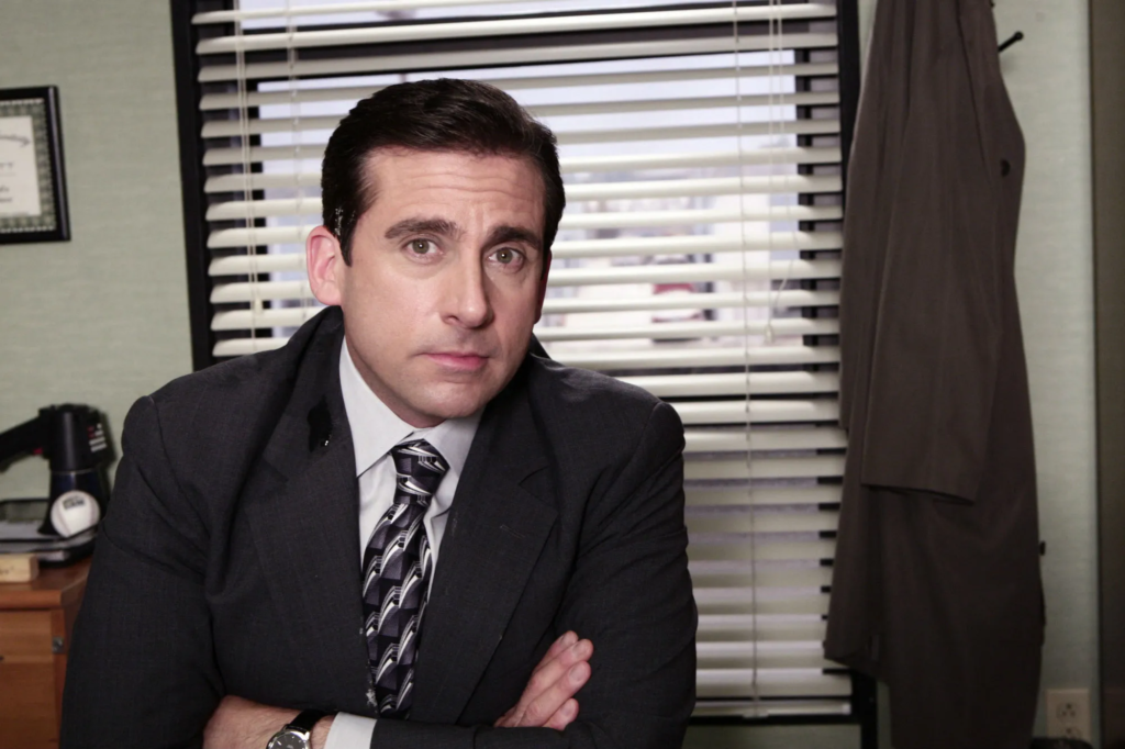 Steve Carell as Michael Scott, the regional manager of the Dunder Mifflin Scranton branch in the popular mockumentary sitcom The Office