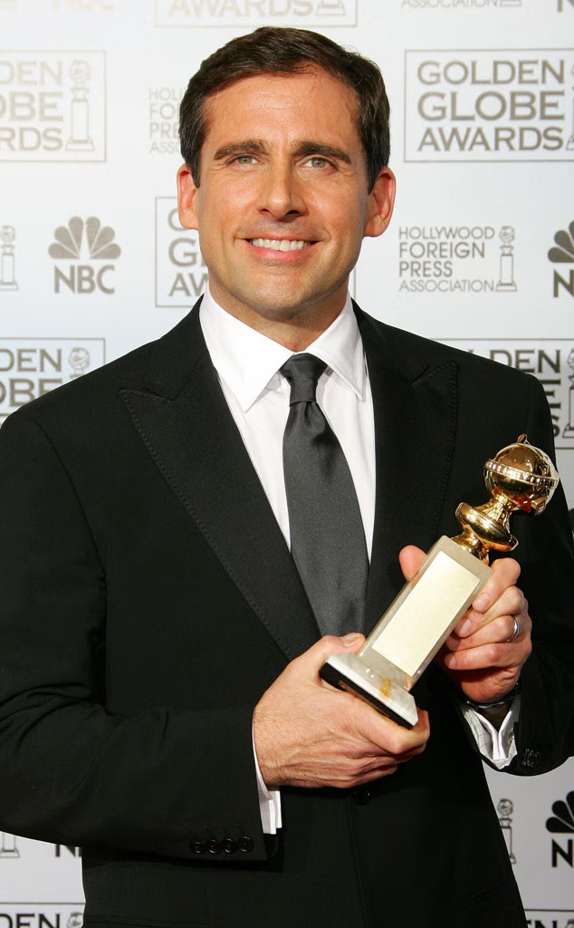 Steve Carell holding his Golden Globe award