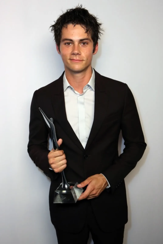 Dylan O'Brien with his award at the 2014 Young Hollywood Awards