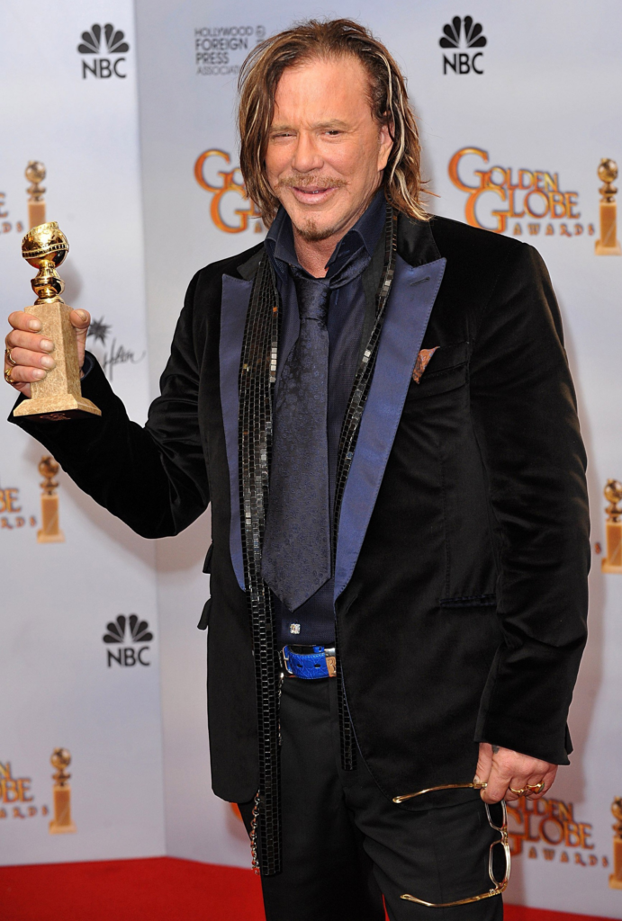 Mickey Rourke holding his Golden Globe