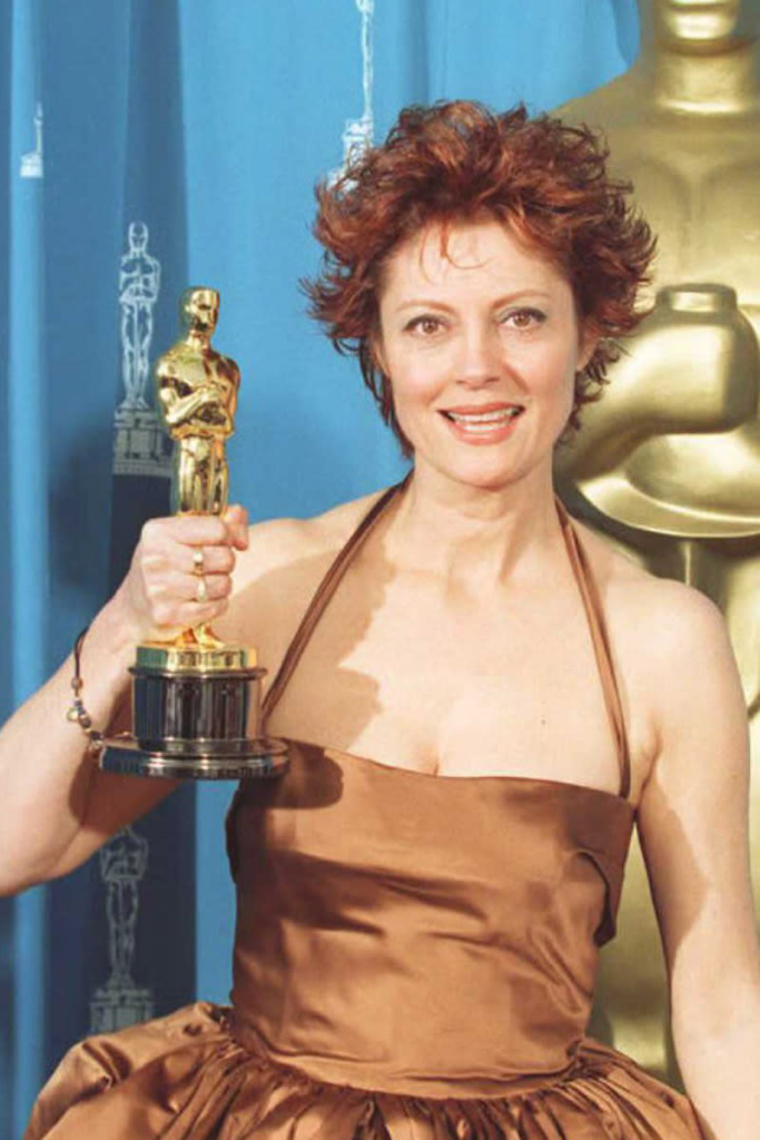 Susan Sarandon holding her Academy Award