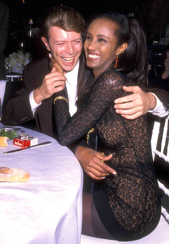 David Bowie and Iman laughing at an event