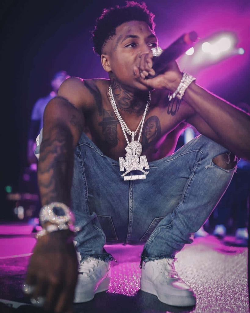 NBA YoungBoy performing on stage