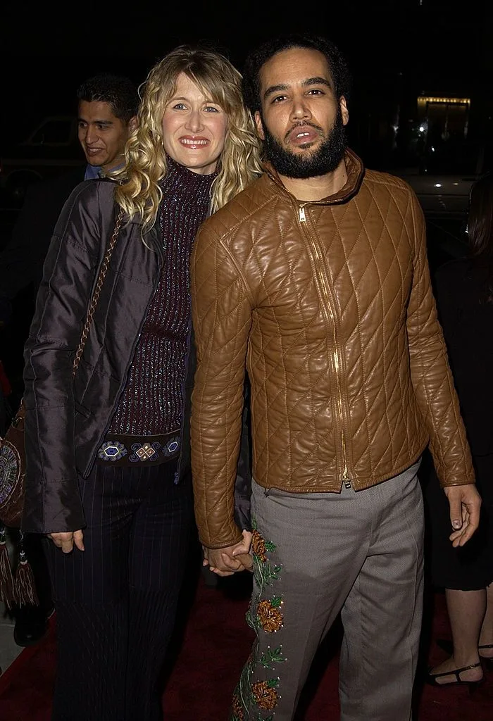 Laura Dern and Ben Harper holding hands