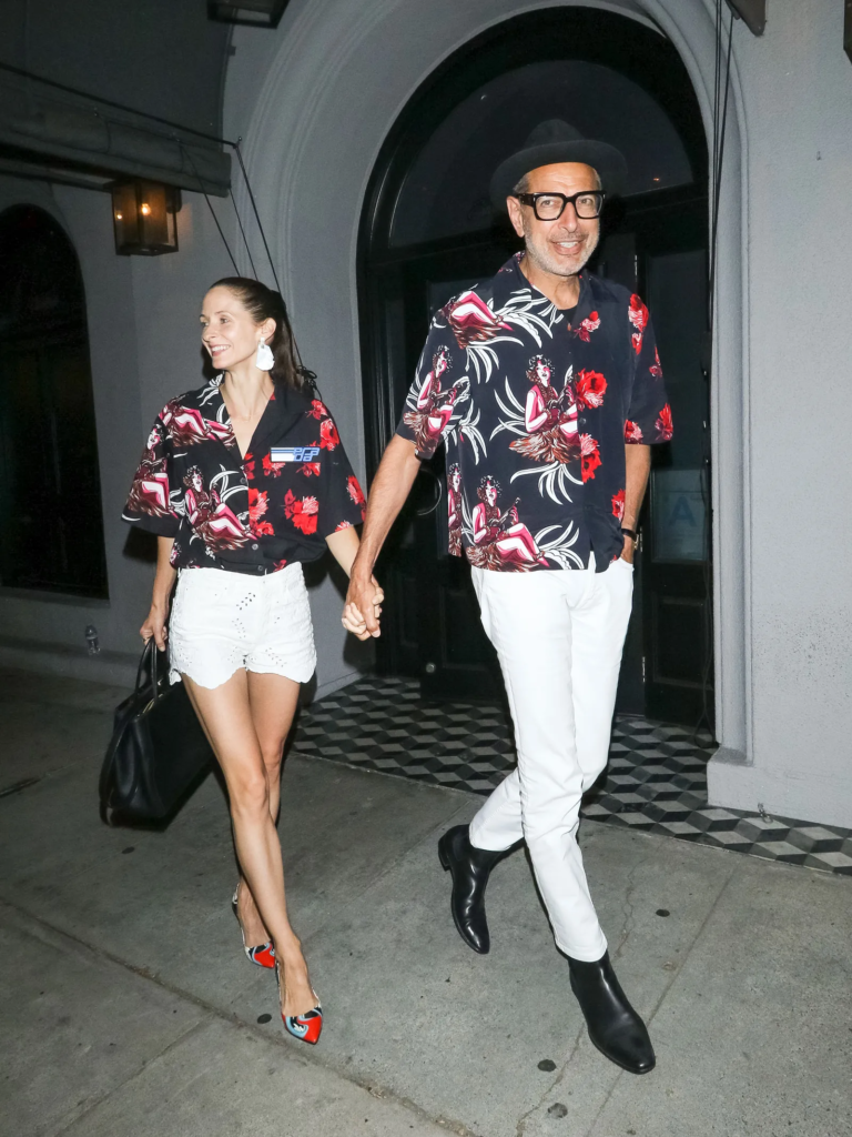 Jeff Goldblum and Emilie Livingston holding hands