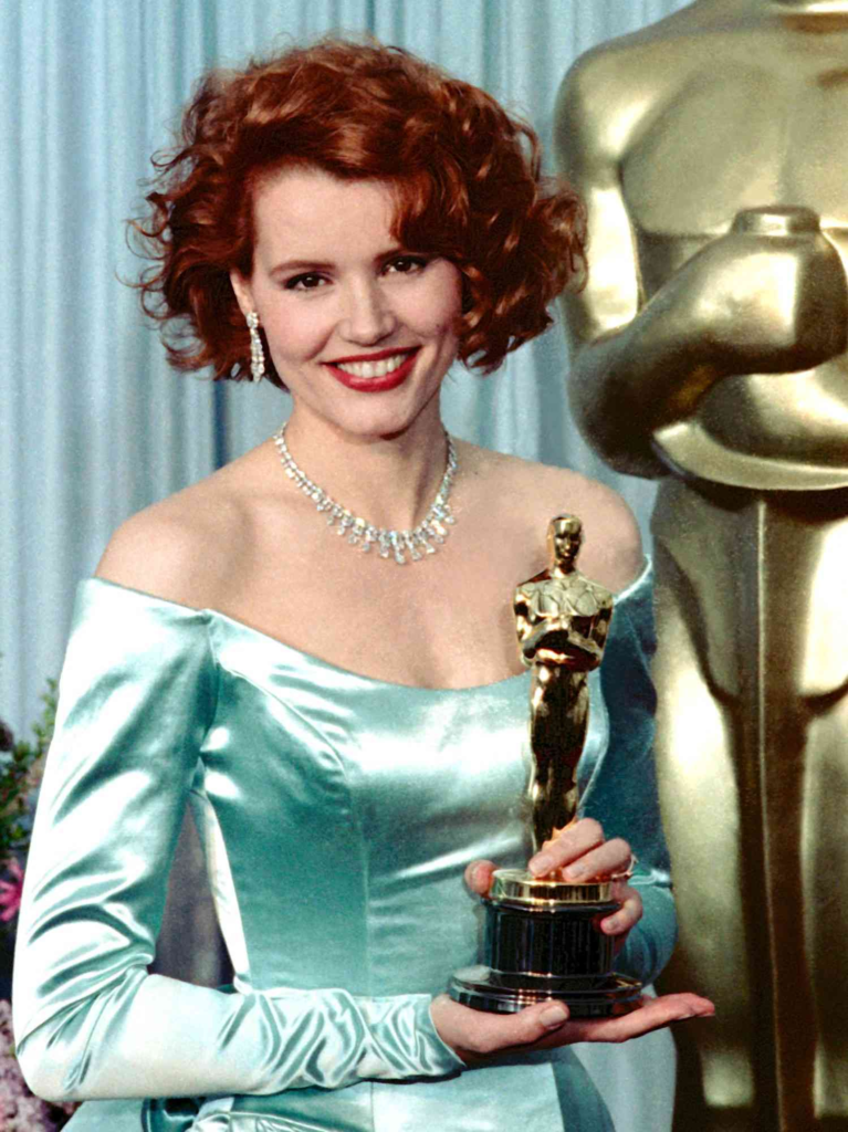 Geena Davis holding her Academy Award