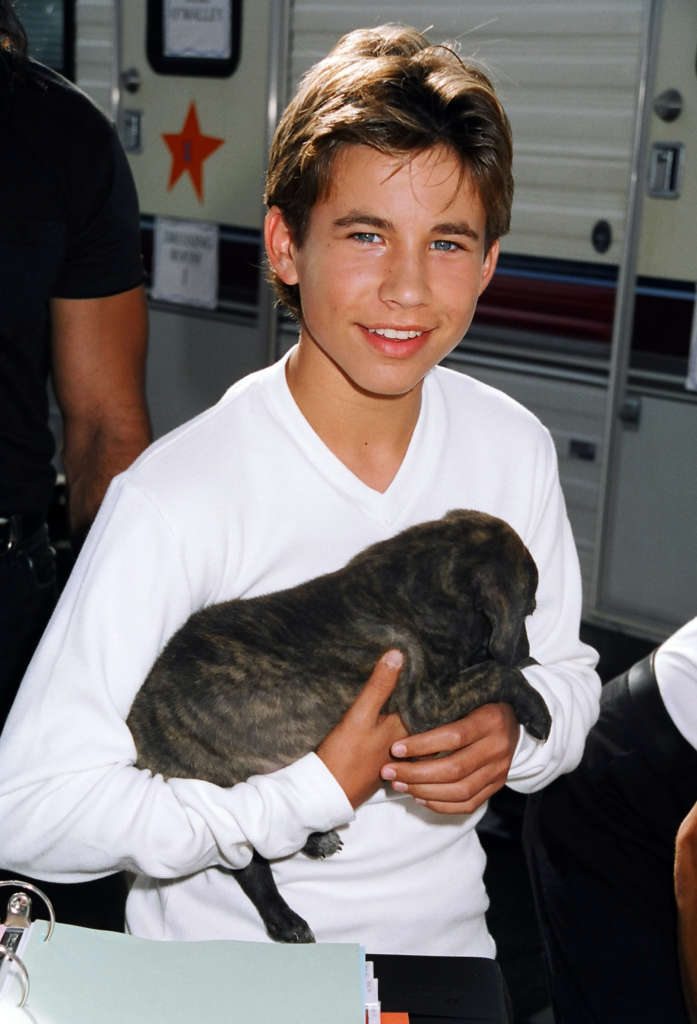 Jonathan Taylor Thomas holding his pet