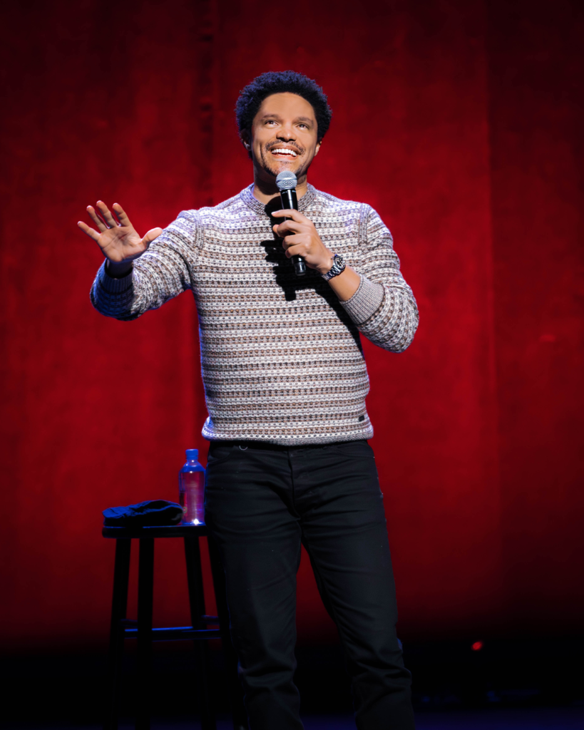 Trevor Noah performing stand up comedy