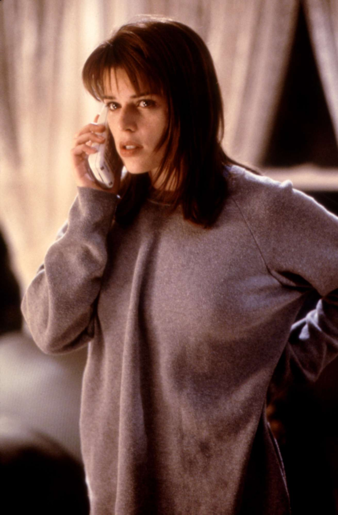 Neve Campbell portraying the character Sidney Prescott in the 1996 horror film Scream