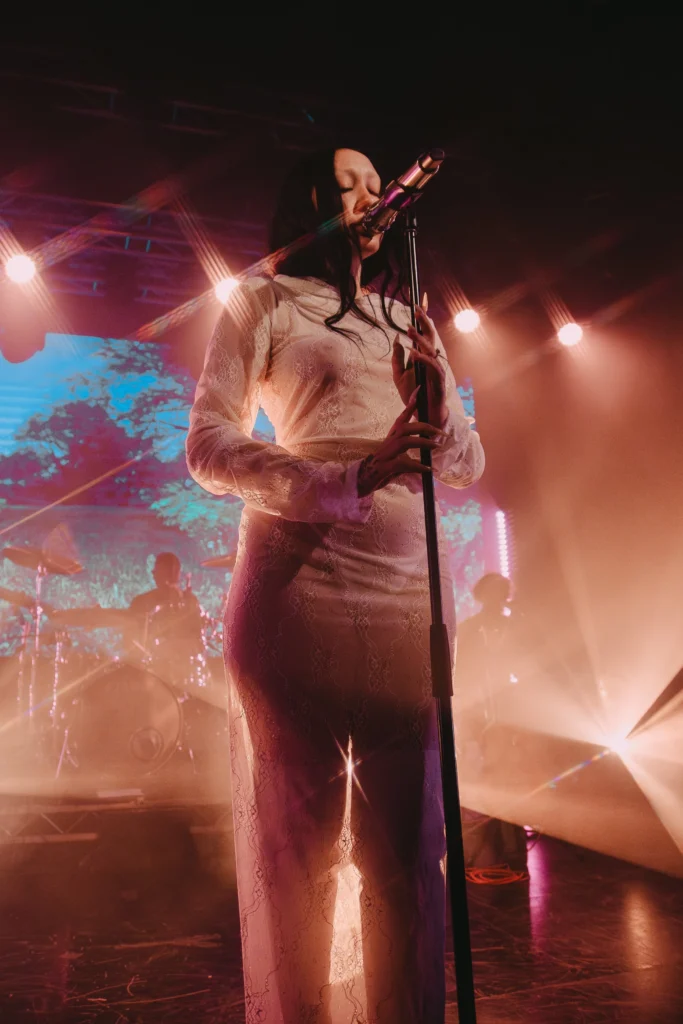 Noah Cyrus performing live on stage during a concert