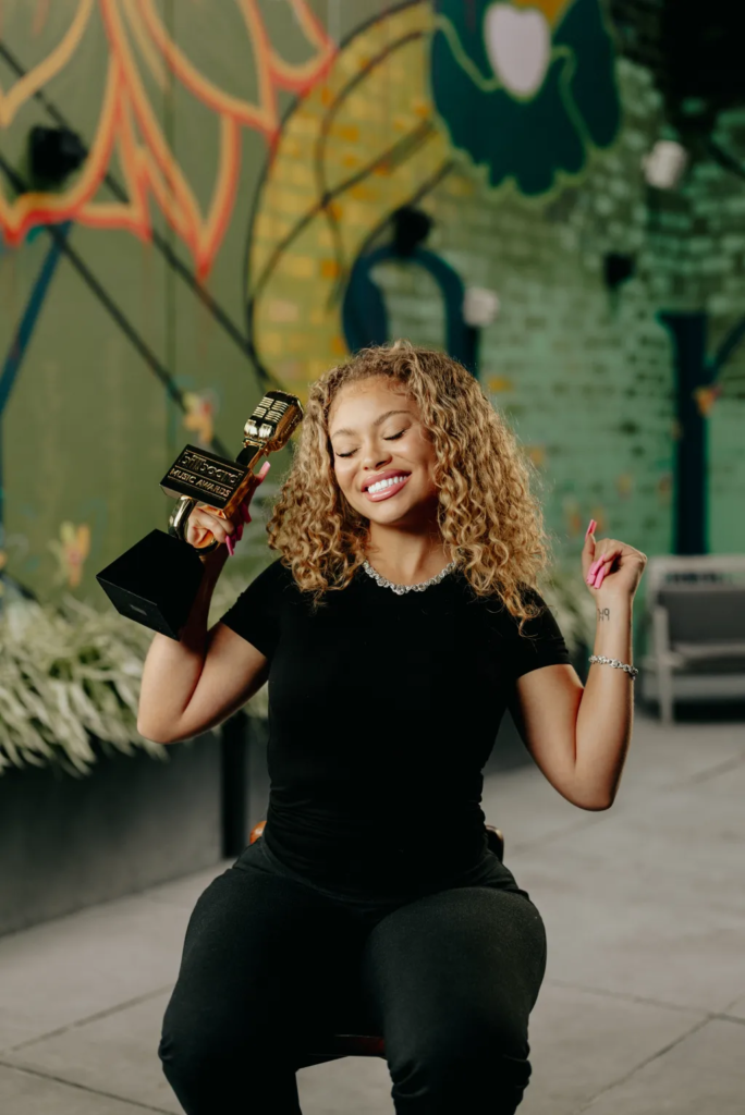 Latto celebrating her win at the 2023 Billboard Music Awards