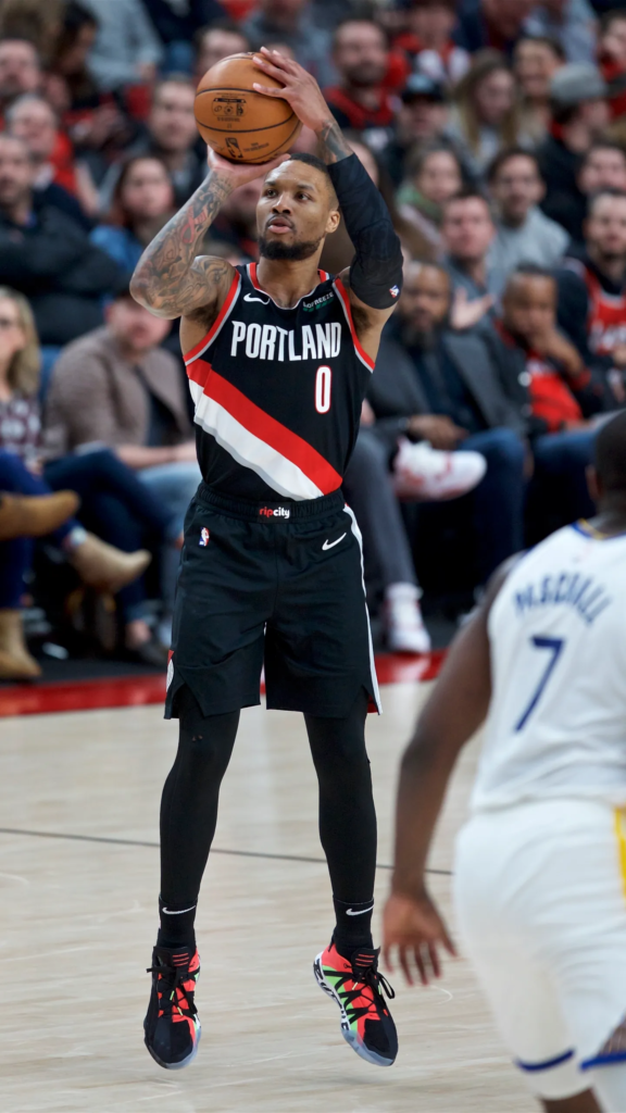Damian Lillard taking a jump shot during a game for the Portland Trail Blazers