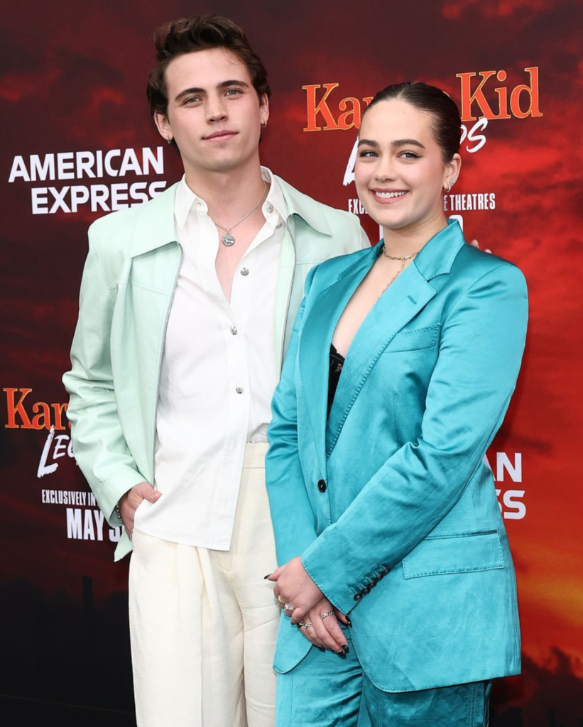 Tanner Buchanan and Mary Mouser at the "Karate Kid: Legends" premiere in New York City on May 27, 2025