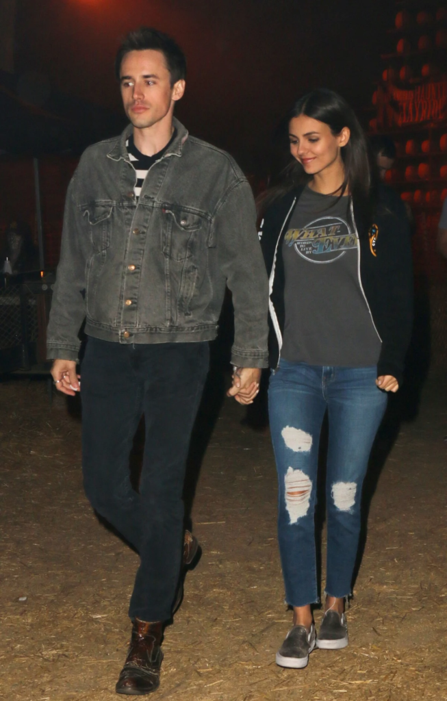 Victoria Justice and Reeve Carney holding hands