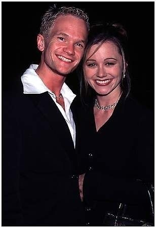 Christine Taylor and Neil Patrick Harris smiling