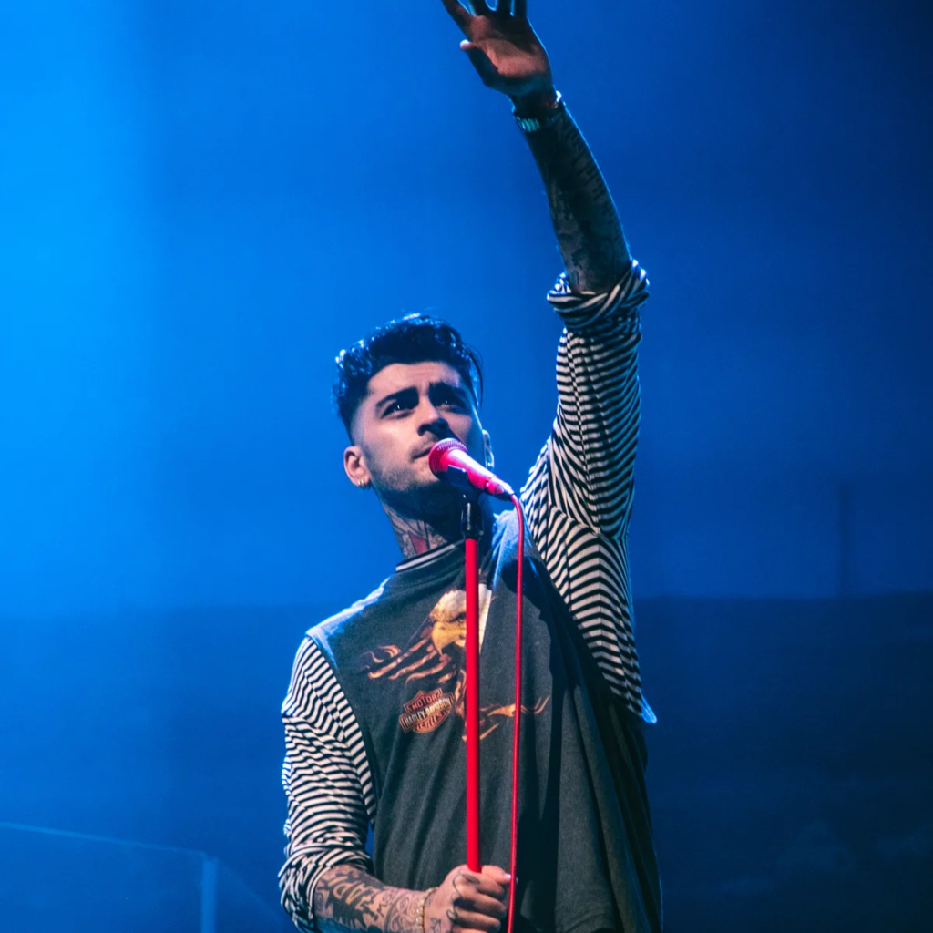 Zayn Malik performing on stage during a concert