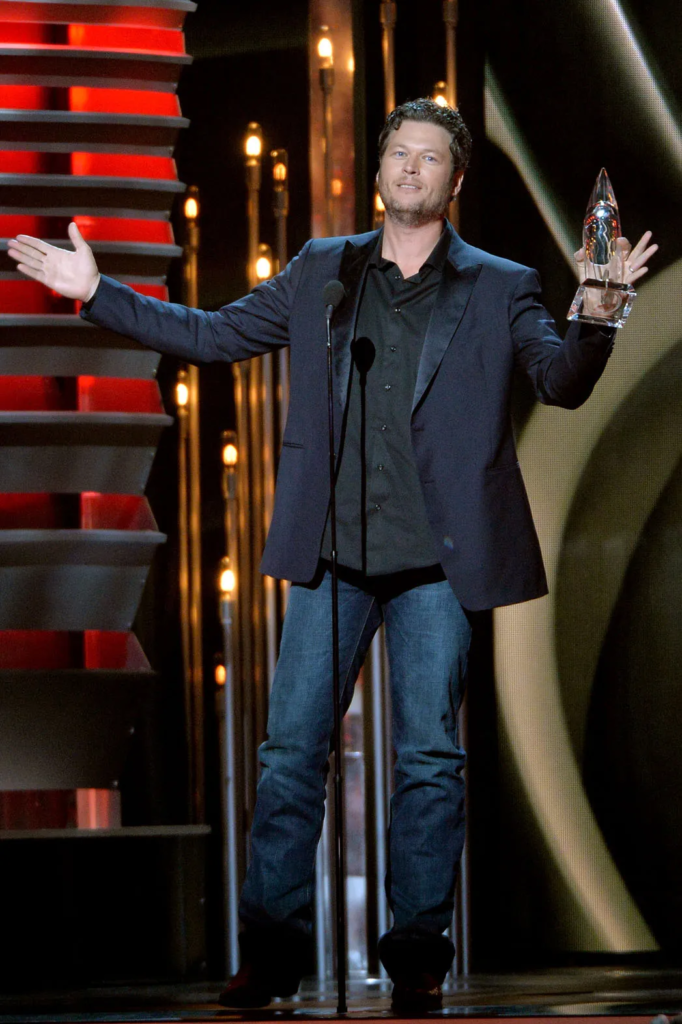 Blake Shelton accepting an award on stage at the 47th Annual CMA Awards in Nashville, Tennessee, in 2013