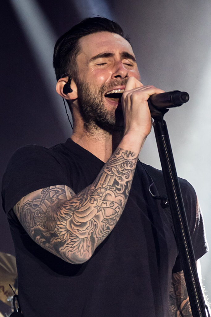 Maroon 5 front man, Adam Levine performing on stage