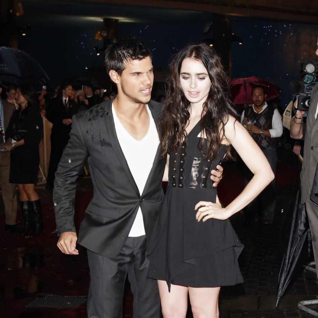 Taylor Lautner and Lily Collins at an event
