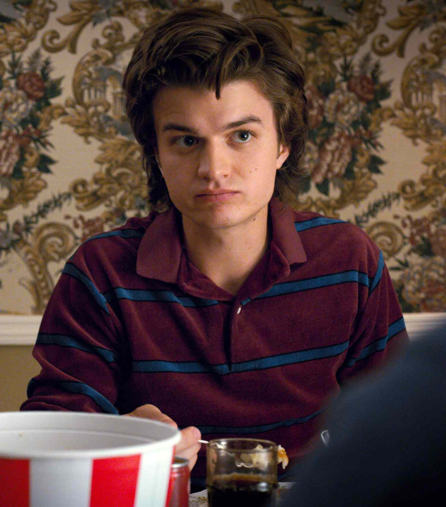 Joe Keery, an actor and musician, in character as Steve Harrington from the Netflix series Stranger Things