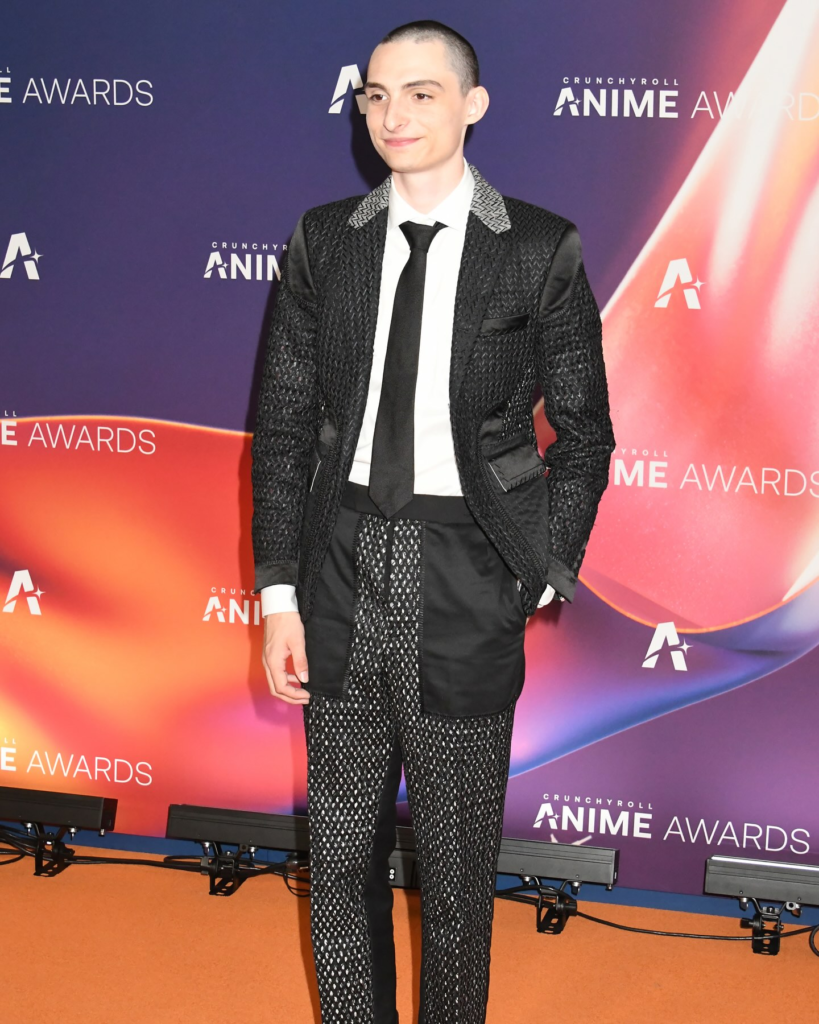 Finn Wolfhard is pictured on the orange carpet at the 2025 Crunchyroll Anime Awards in Tokyo, Japan