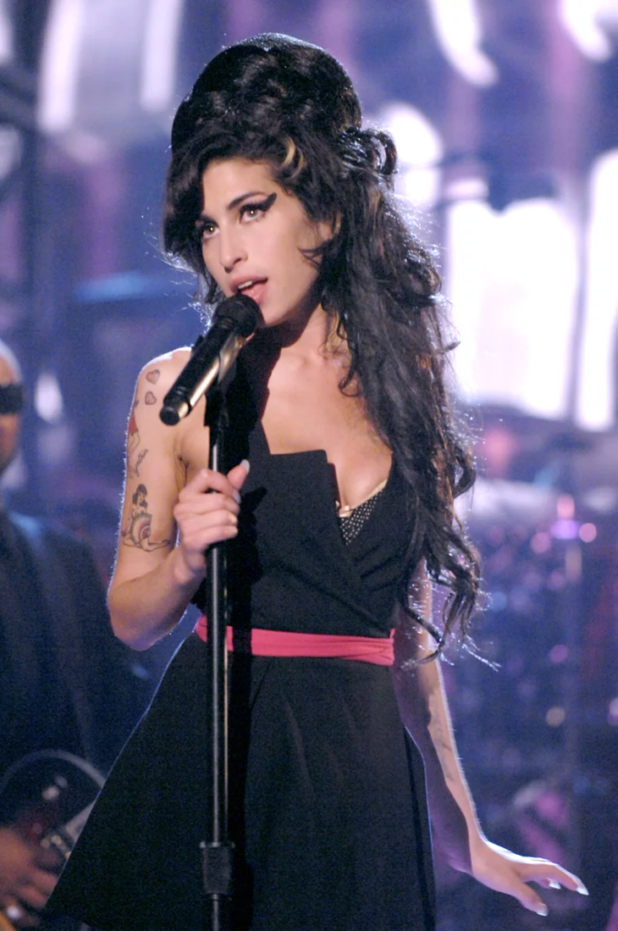 late singer-songwriter, Amy Winehouse performing on stage