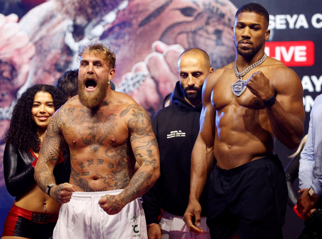 Anthony Joshua facing off against influencer and boxer Jake Paul at their weigh-in event