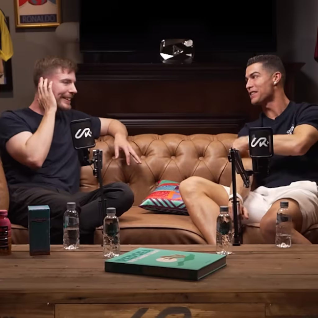 football icon Cristiano Ronaldo and content creator MrBeast collaborating on a YouTube video