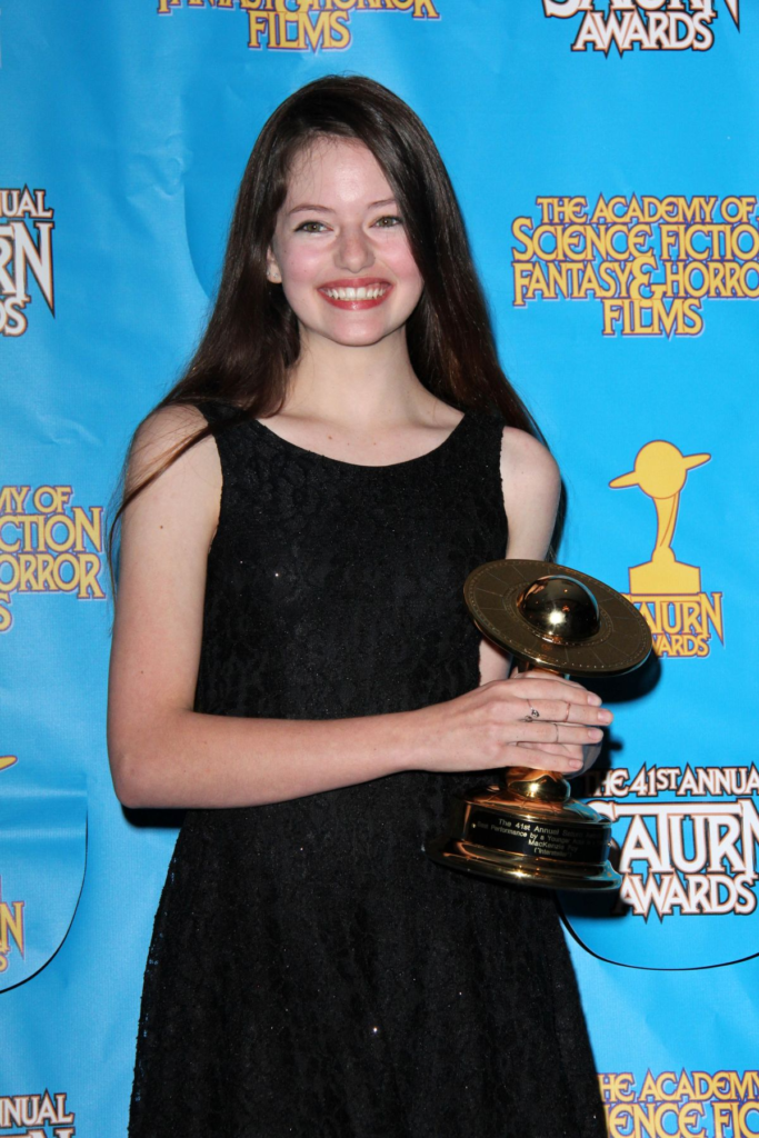 American actress Mackenzie Foy posing with an award at the 41st Annual Saturn Awards in June 2015