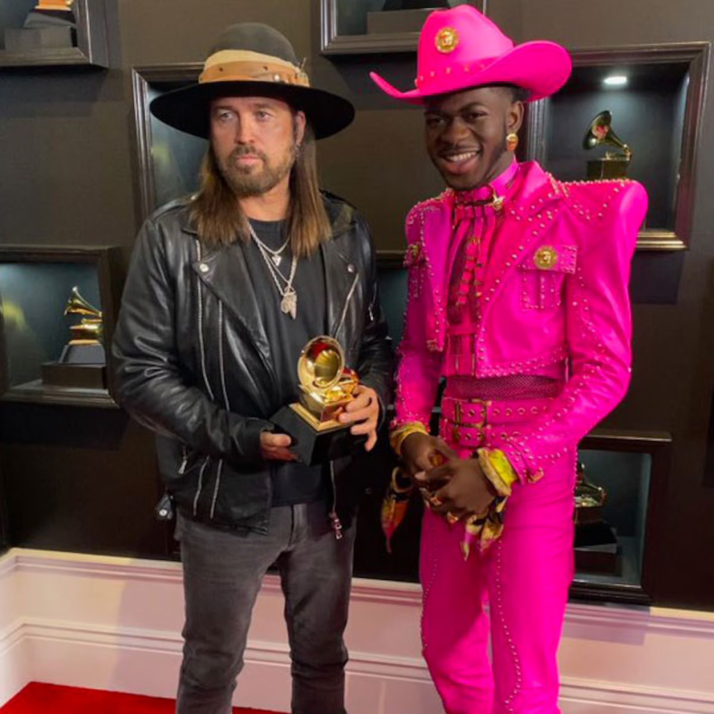 Billy Ray Cyrus and Lil Nas X posing with their Grammy Awards at the 62nd Annual Grammy Awards ceremony on January 26, 2020, in Los Angeles, California