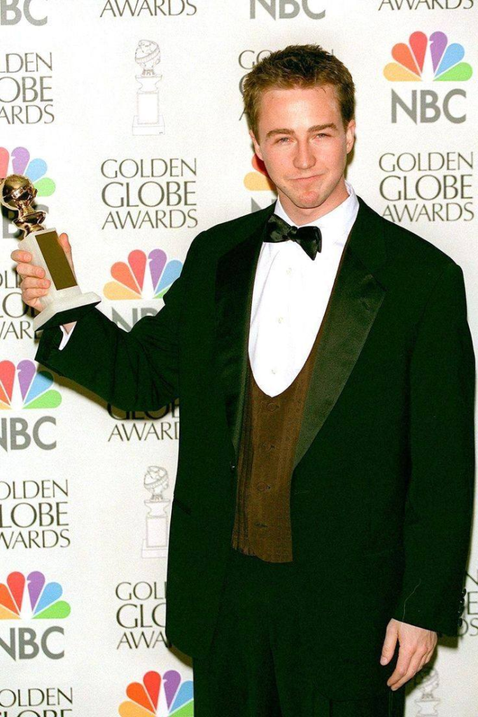 Edward Norton posing with a Golden Globe award at the 54th Annual Golden Globe Awards