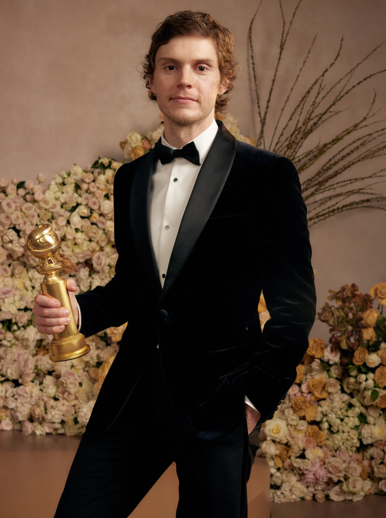 Evan Peters holding a Golden Globe award after winning Best Actor in a Limited Series for his role in "Dahmer – Monster: The Jeffrey Dahmer Story" in 2023