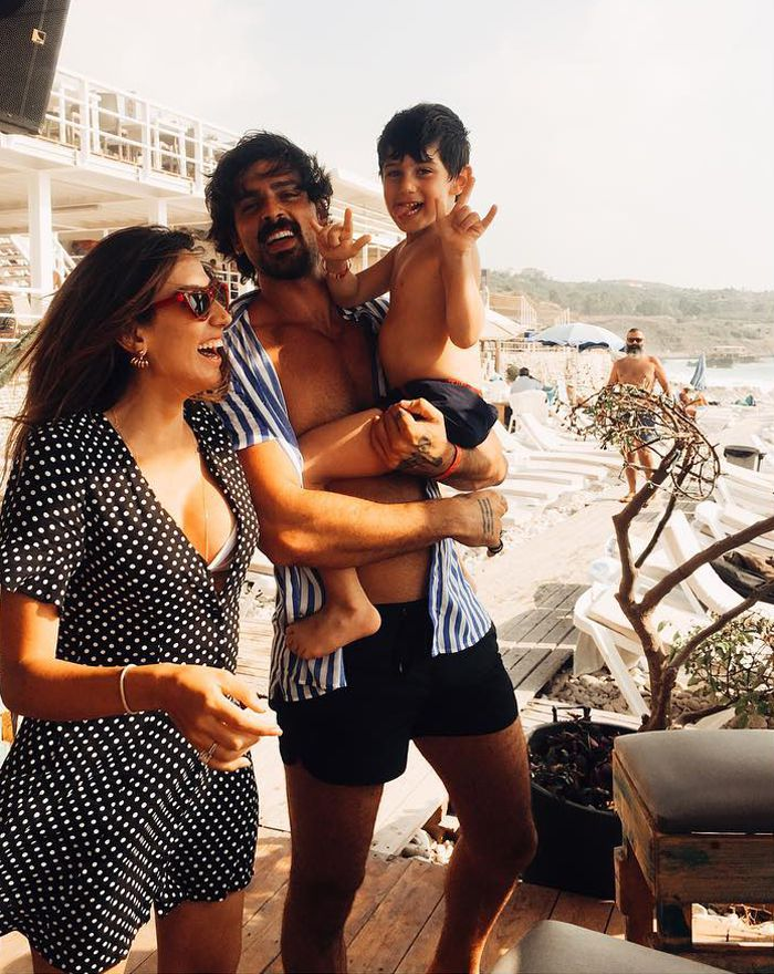 Michele Morrone and Rouba Saadeh, their kid at the beach
