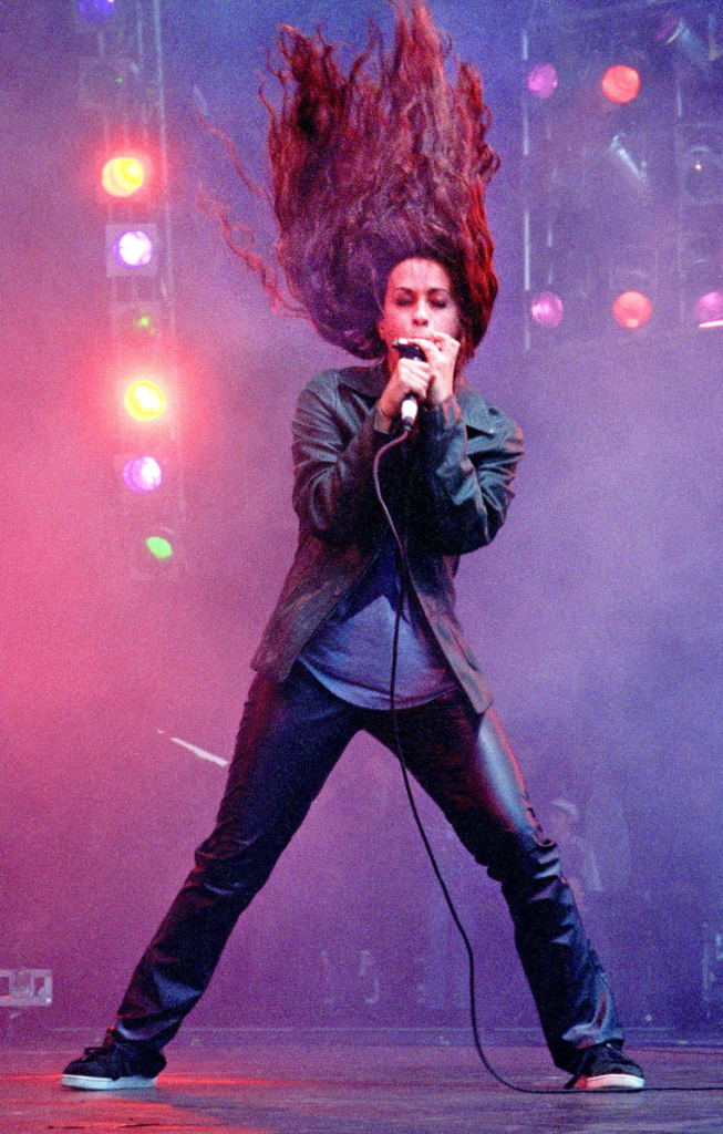 Canadian-American singer-songwriter Alanis Morissette performing on stage