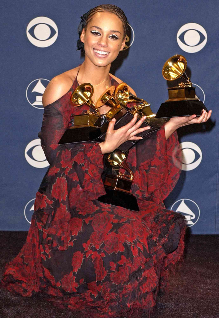 Alicia Keys celebrating her historic wins at the 44th Annual Grammy Awards in 2002