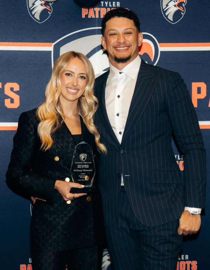 Brittany Mahomes being inducted into the University of Texas at Tyler Athletics Hall of Fame on March 28, 2026, accompanied by her husband, Patrick Mahomes