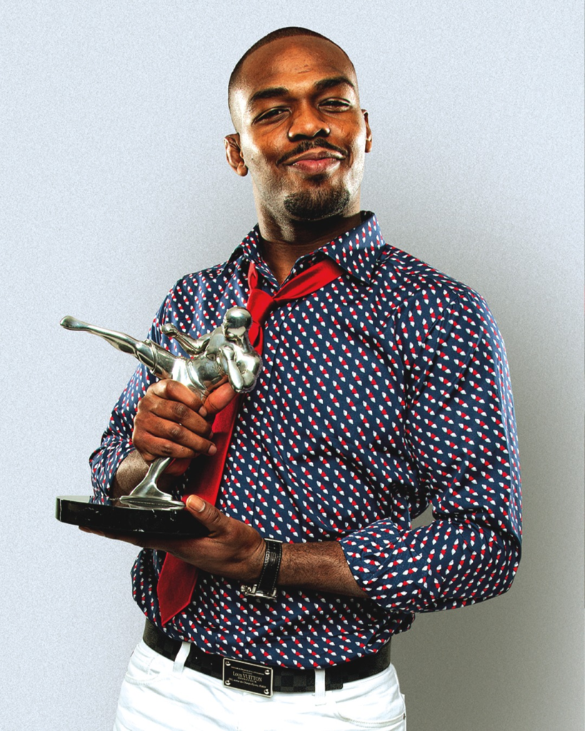 Jon Jones posing with a trophy at the World MMA Awards