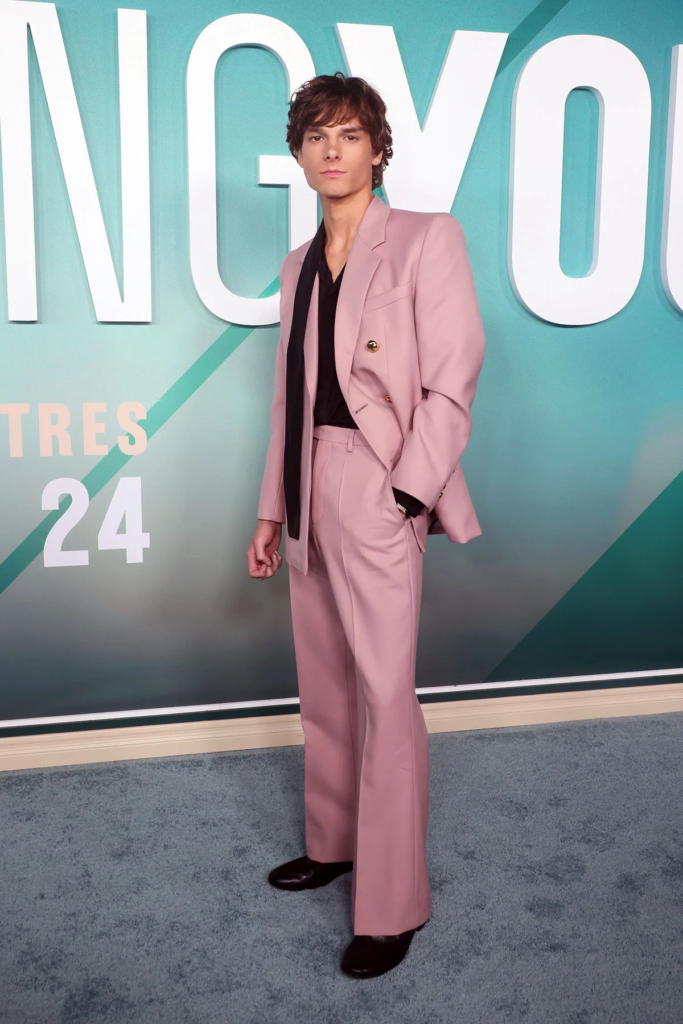 actor Mason Thames wearing a tailored pink suit by Valentino at the Los Angeles premiere of his film Regretting You