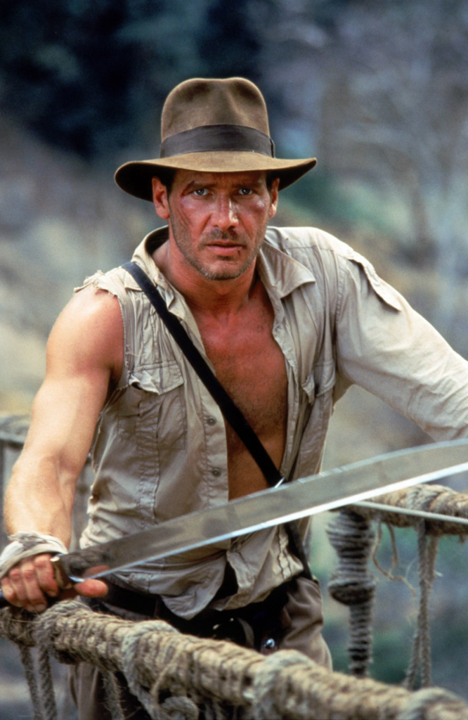 Harrison Ford as the iconic character Indiana Jones in the 1984 film Indiana Jones and the Temple of Doom