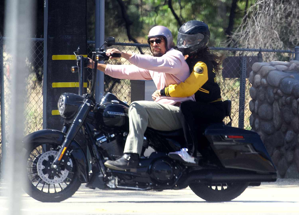 Eiza González and Jason Momoa riding a motorcycle