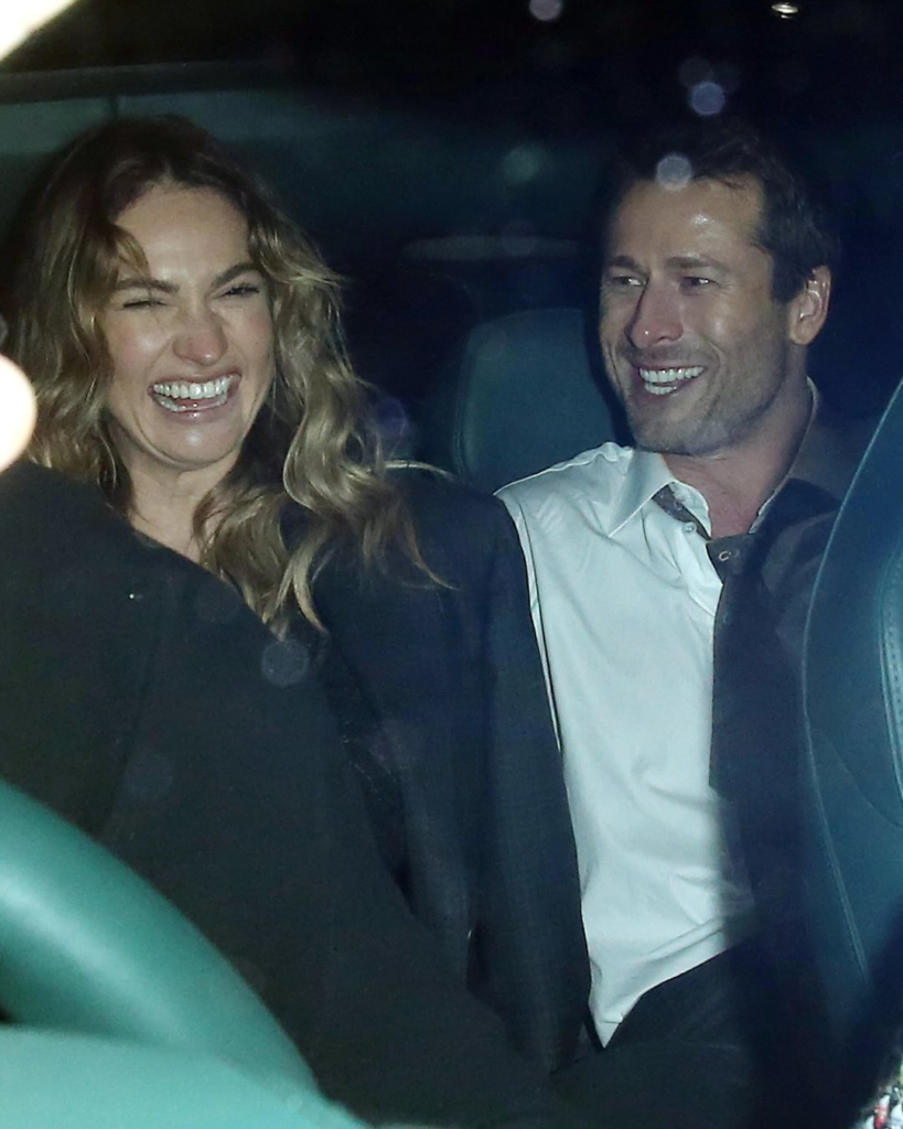 Lily James and Glen Powell laughing
