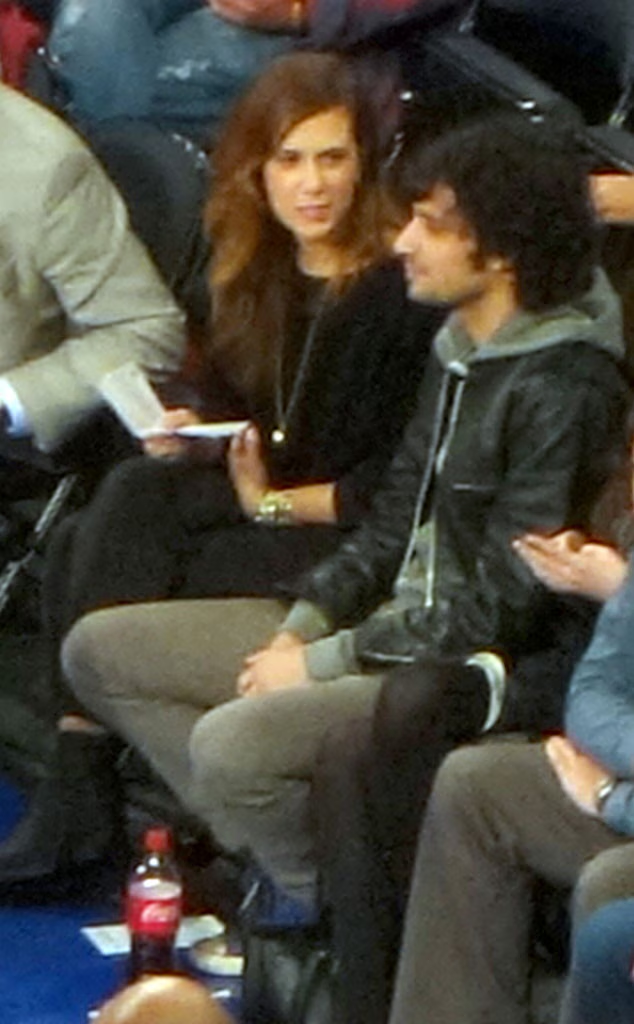 Kristen Wiig and Fabrizio Moretti at a game