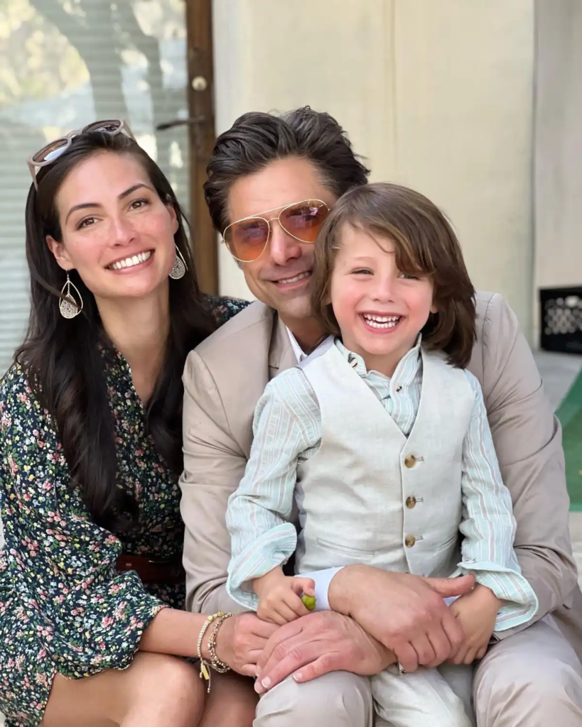 John Stamos and Caitlin McHugh with their kid
