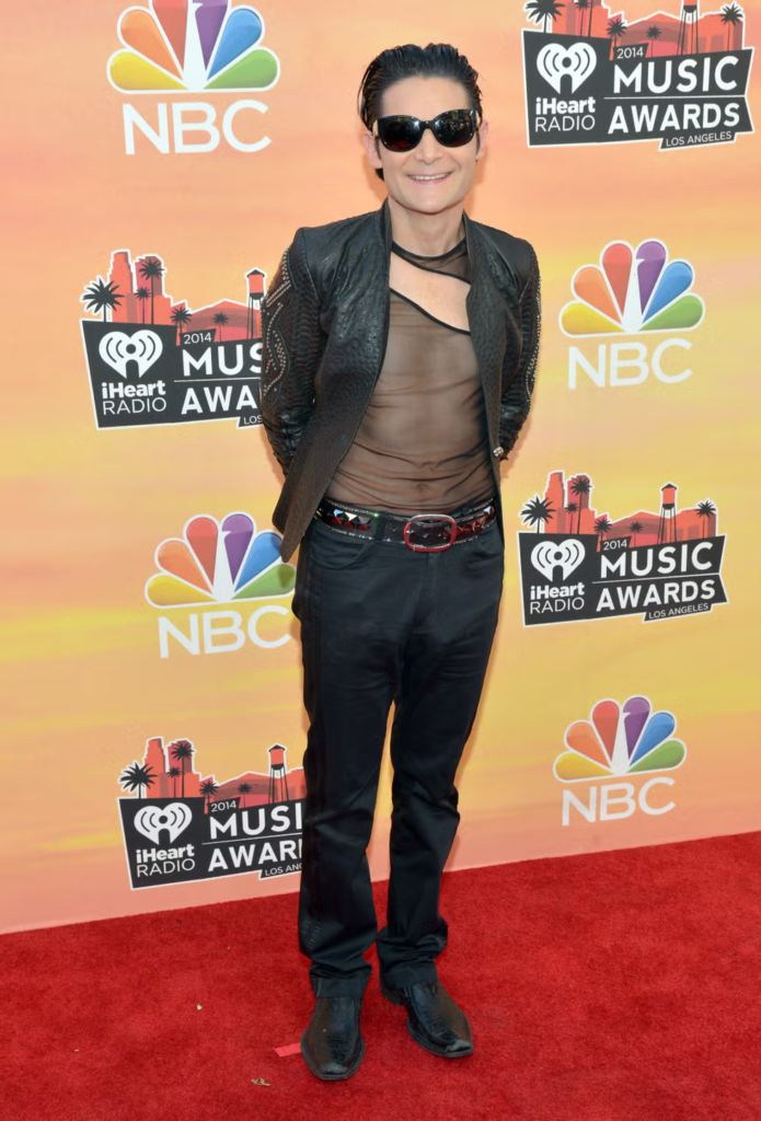 Corey Feldman wearing a black leather jacket and a sheer mesh top at the 2014 iHeartRadio Music Awards