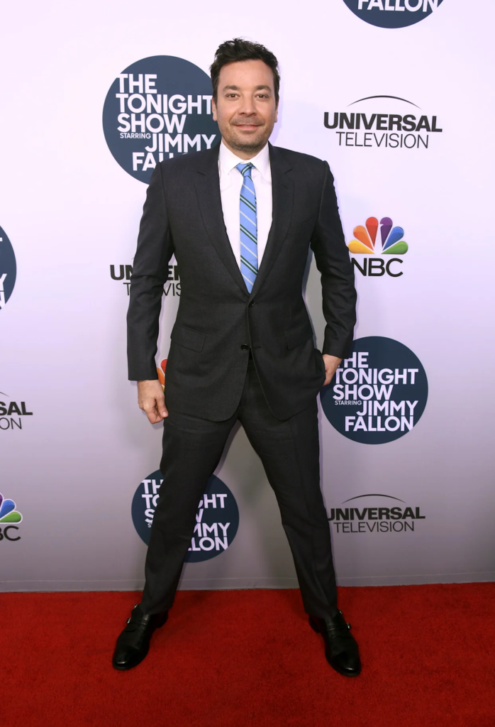 Jimmy Fallon, the host of The Tonight Show Starring Jimmy Fallon, wearing a classic dark suit
